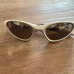 Oakley Cream Sunglasses with Brown Lenses